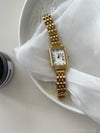 Color: Gold Strap White Surface