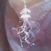 Color: Pink blue jellyfish alone