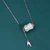 Color: White gold necklace