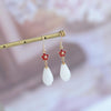 style: White magnolia red zircon